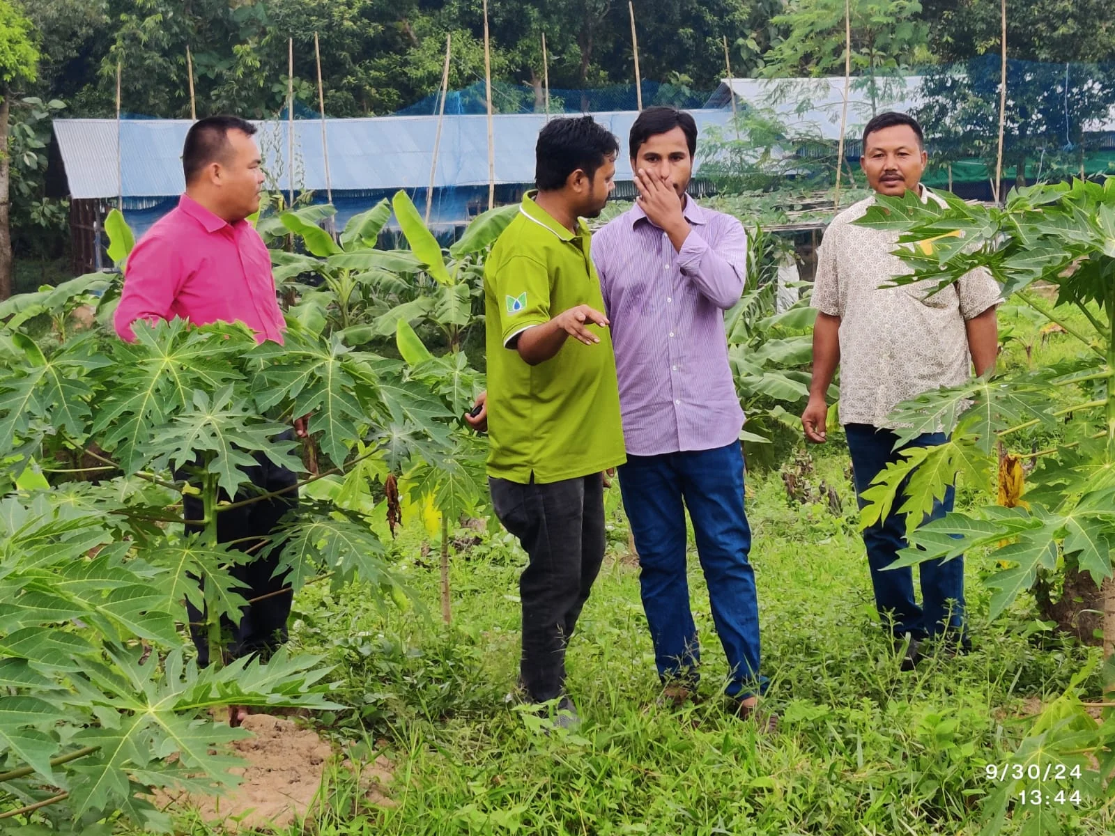 Field team members reviewing a production site in Bangladesh
